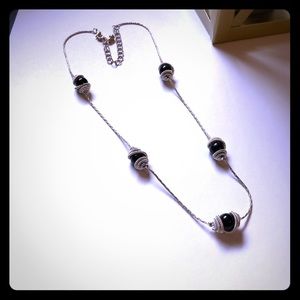 Silver necklace with black beads